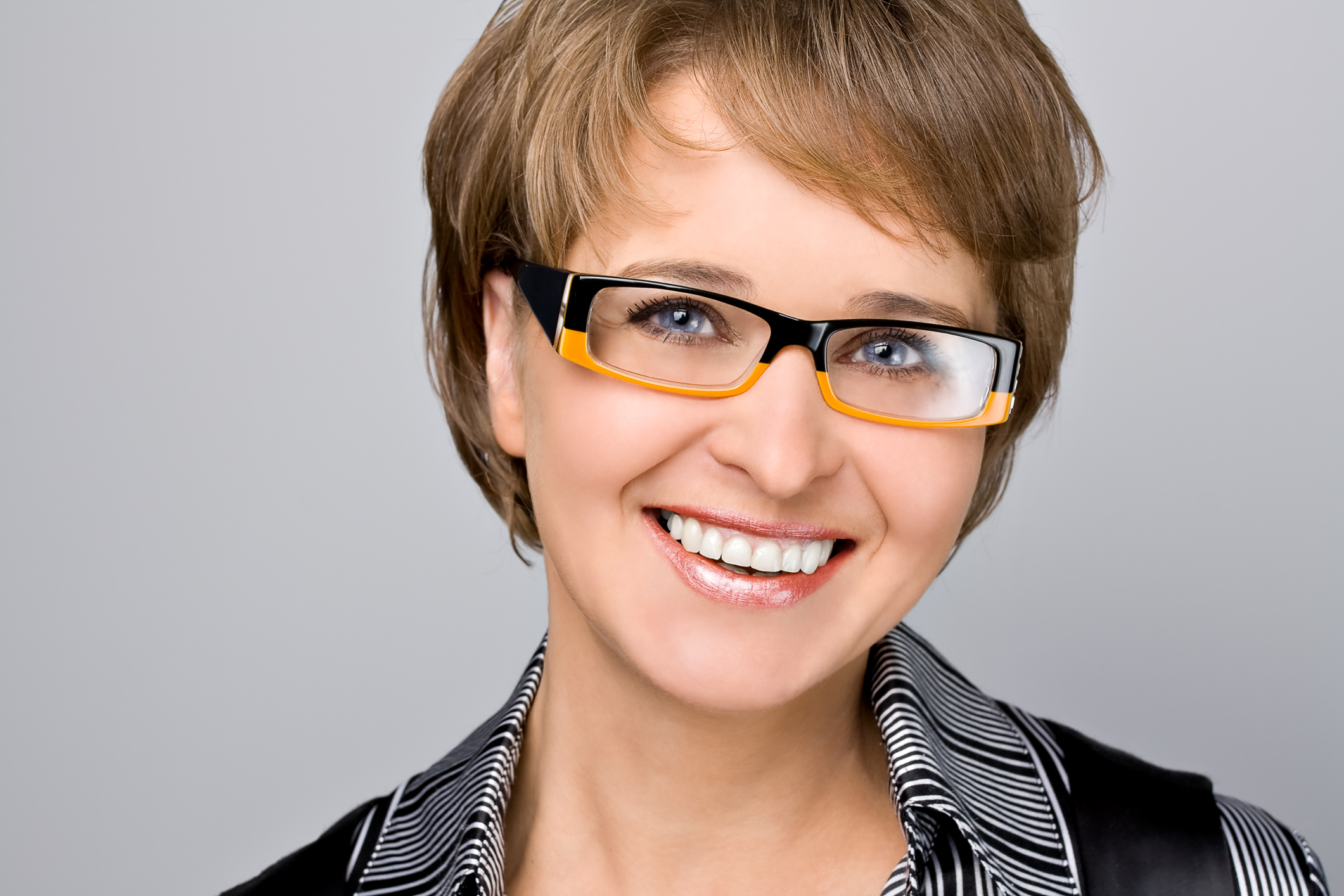 Smiling Woman Glasses Amac Broker Services